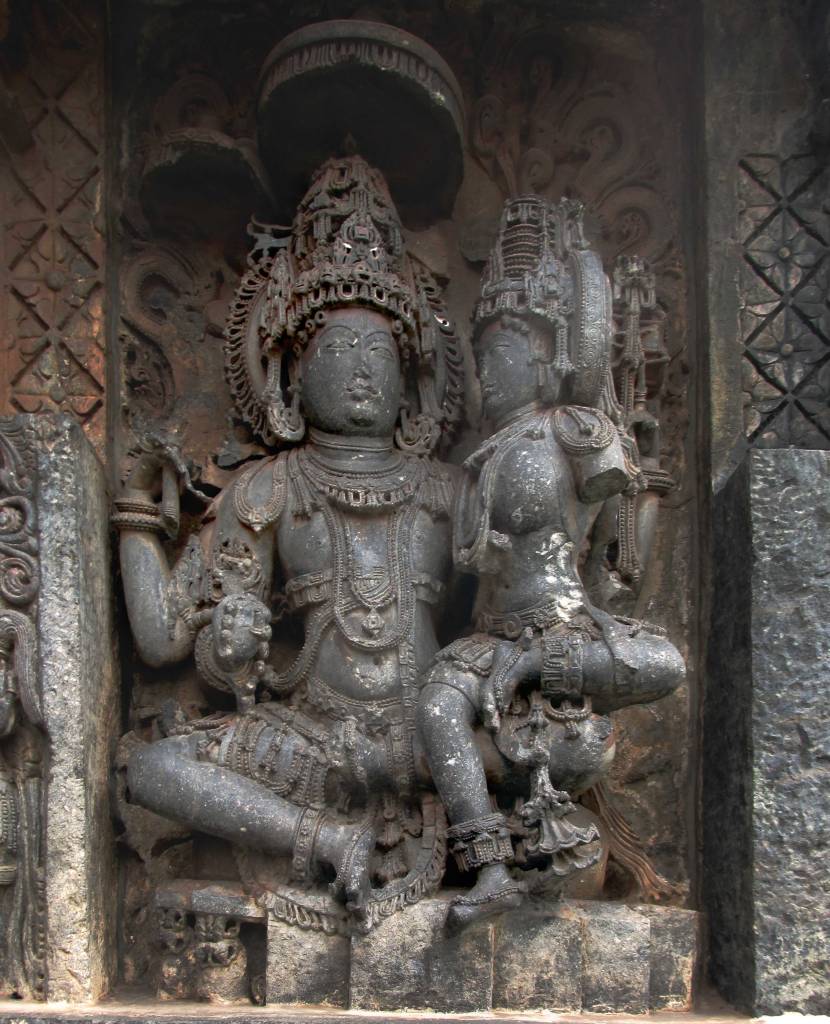 Uma–Maheshwara / उमामहेश्वर is a form of a divine couple. Here, Uma refers to Goddess Parvati and Maheshwar refers to Lord Shiva. They could be reffered to as Gauri-Shankar or Shiv-Parvati too.
Uma and Maheshwara are both adorned with a diadem of jewels, as well as royal clothing and ornaments. They sit on a throne with a canopy over their heads and a decorative backrest behind them.